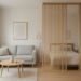 Modern small apartment with a wooden slat room divider separating the living and bedroom areas.