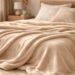 barefoot dreams blanket soft plush texture on bed in cozy bedroom setting