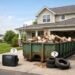 roll off dumpster in driveway with home renovation debris