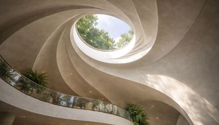 Circular skylight opening in curved ceiling inside Nautilus House Mexico