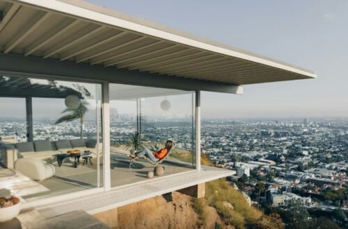 Stahl House interior with floor-to-ceiling glass walls overlooking Los Angeles skyline