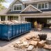 Residential dumpster in driveway during home renovation cleanup