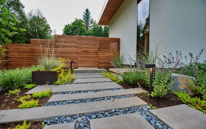Modern gravel garden with stone pathways and drought-tolerant plants