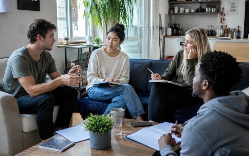 Roommates discussing house rules before moving in