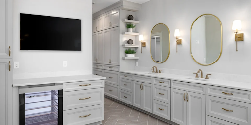 Timeless luxury bathroom with white vanity cabinets and gold mirrors
