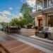 Composite decking reviews showing a premium modern backyard deck with wood-look composite boards