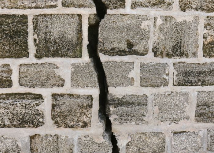 Foundation wall crack showing potential structural moisture damage