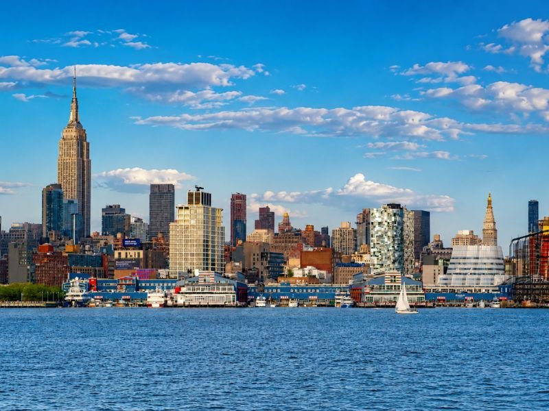 New Jersey waterfront skyline with modern high-rise buildings, waterfront development, and scenic views illustrating the state's appeal for remote workers seeking urban access and lifestyle balance.