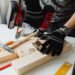 Homeowner performing repairs to prevent costly home damage