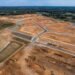 Raw land being transformed into a residential development with roads and utilities