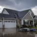 Storm damaged residential roof showing signs requiring repair
