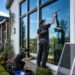 Professional cleaning window glass, frames, tracks, sills, and screens on a modern home