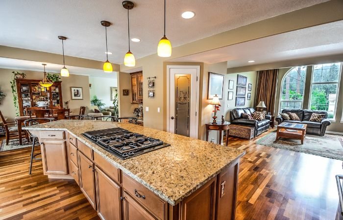Spacious modern kitchen featuring granite island, quality cabinetry, and durable fixtures for reliable everyday plumbing