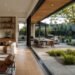 Modern home with open glass doors connecting living room to outdoor patio and garden