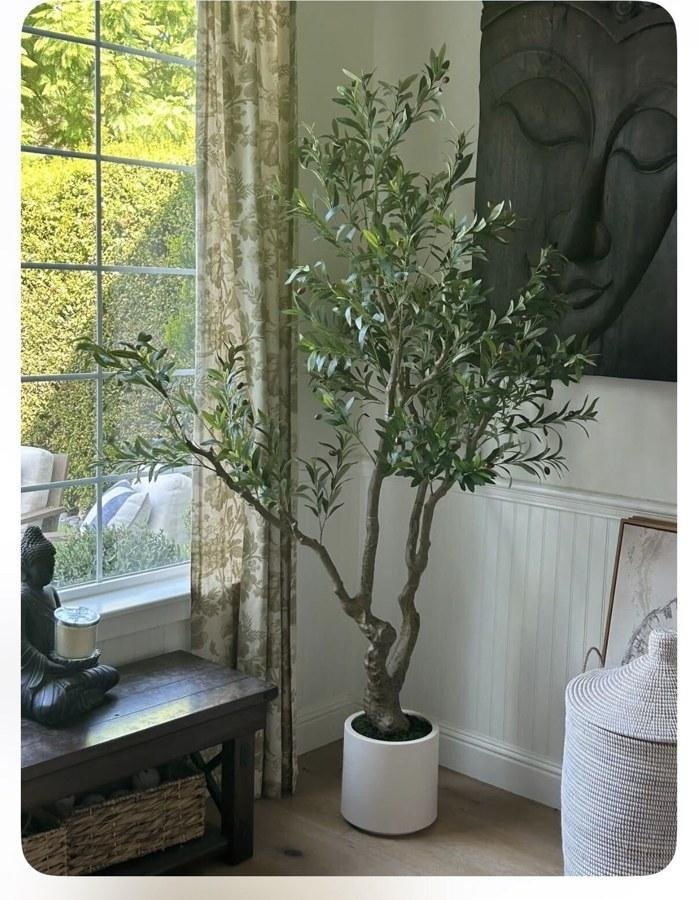 Close-up of a faux olive tree’s hand-finished trunk