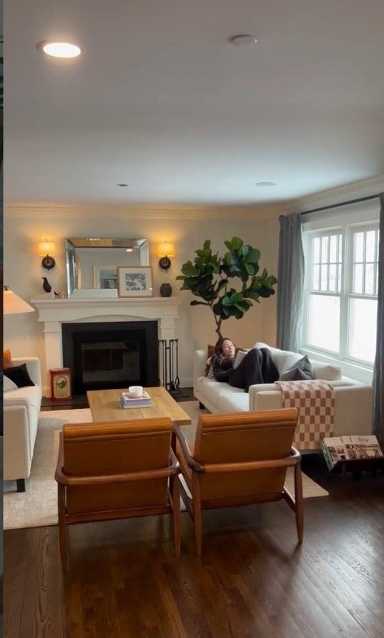 A real customer’s living room with a faux fiddle-leaf fig by the fireplace